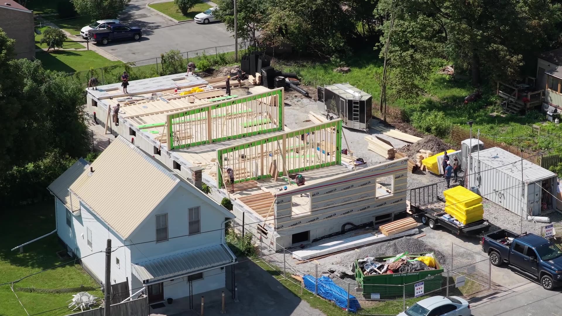 Aerial view of four rental townhomes being framed at Frank Street, Peterborough